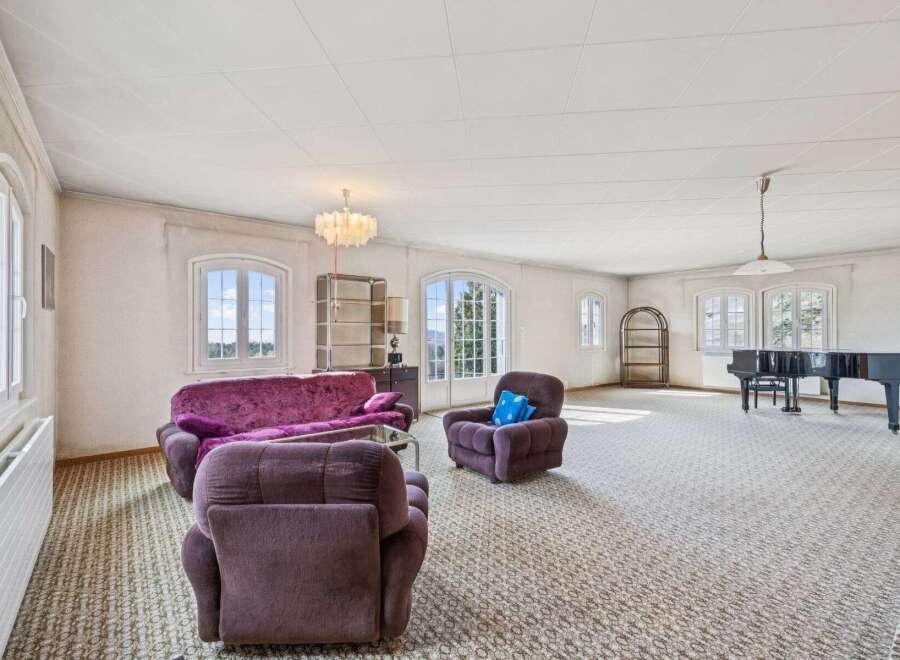 Step into luxury with this spacious living room, perfect for entertaining or relaxing.