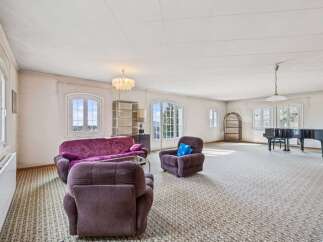 Step into luxury with this spacious living room, perfect for entertaining or relaxing.