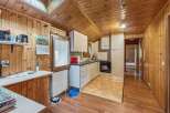 Step into this charming kitchen with its warm wooden accents and inviting atmosphere.