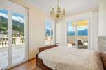 Experience luxury living in this stunning bedroom with breathtaking views.