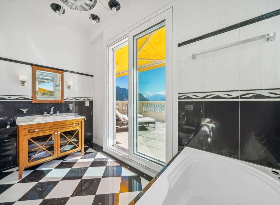 Experience luxury living in this stunning bathroom with breathtaking views.