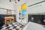 Experience luxury living in this stunning bathroom with breathtaking views.