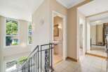 Discover this stunning property featuring a bright and airy hallway with elegant design elements.