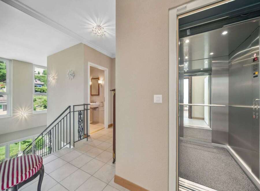 Discover luxury living in this stunning property featuring a modern elevator for easy access to all floors.
