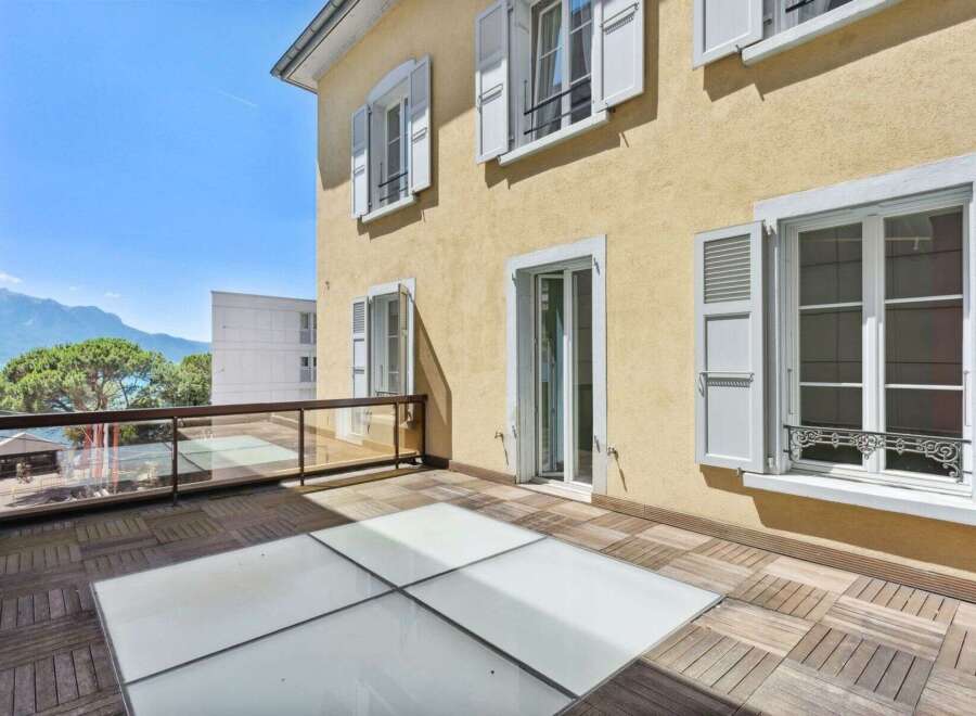 Enjoy breathtaking views from this stunning property, featuring a spacious balcony with a unique glass floor design.