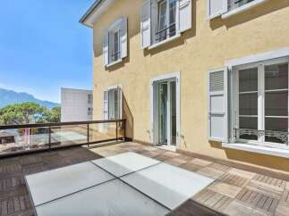 Enjoy breathtaking views from this stunning property, featuring a spacious balcony with a unique glass floor design.
