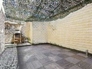 Discover the charm of this outdoor space, perfect for entertaining or relaxing.