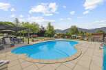 Enjoy the ultimate outdoor living experience with this stunning property! Featuring a beautiful pool, perfect for those hot summer days, and a spacious patio area ideal for entertaining.