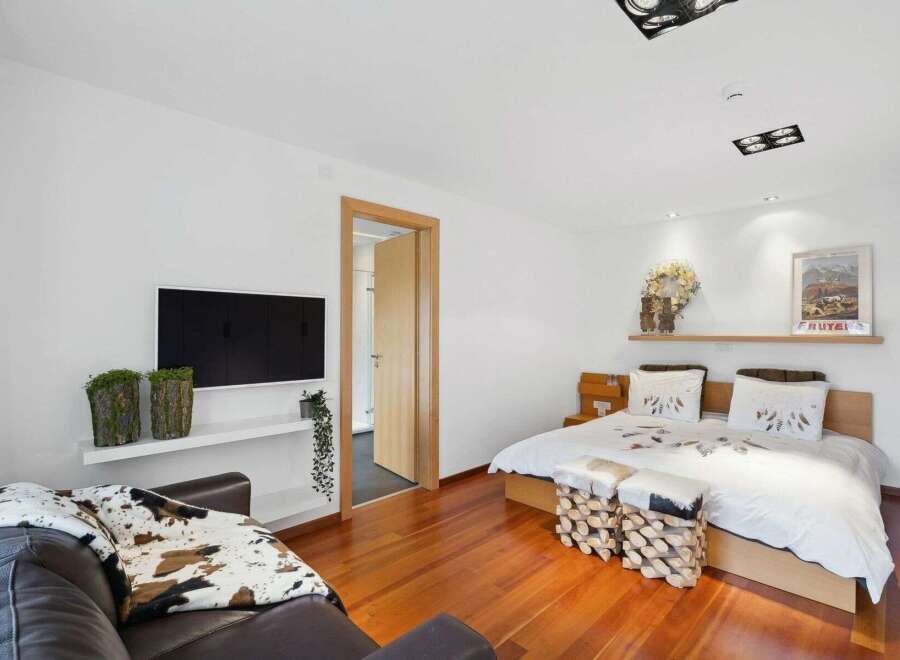 This stunning bedroom boasts a modern design with a touch of rustic charm.