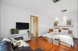 This stunning bedroom boasts a modern design with a touch of rustic charm.