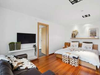 This stunning bedroom boasts a modern design with a touch of rustic charm.