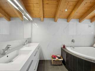 Step into luxury with this stunning bathroom featuring a modern design and high-end finishes.