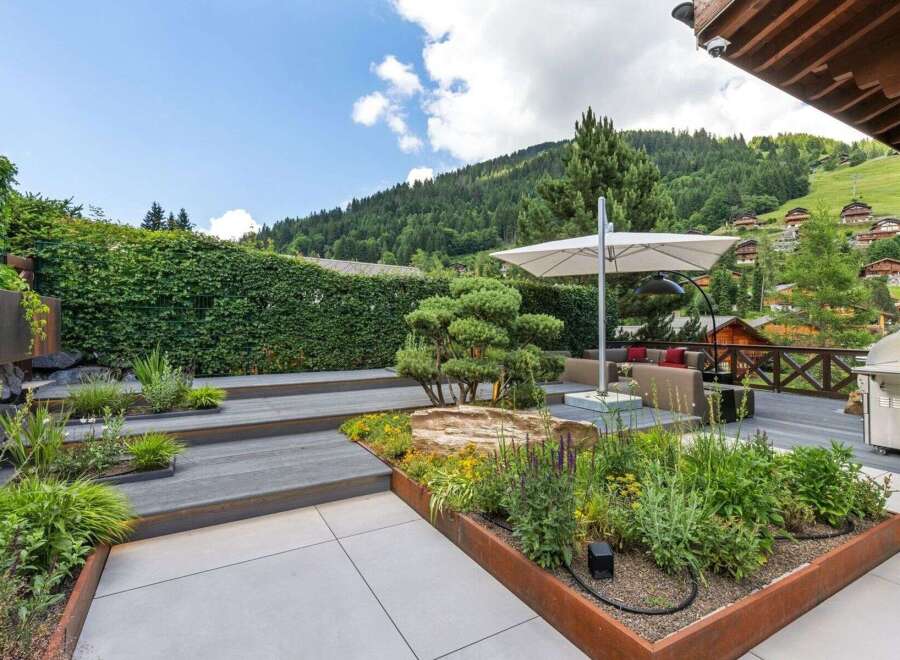 Experience luxury living with this stunning property featuring a beautifully landscaped outdoor space.