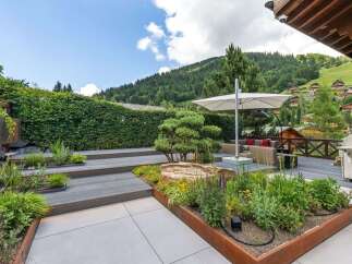Experience luxury living with this stunning property featuring a beautifully landscaped outdoor space.