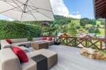 Experience luxury living with this stunning property featuring a spacious outdoor deck and breathtaking mountain views.