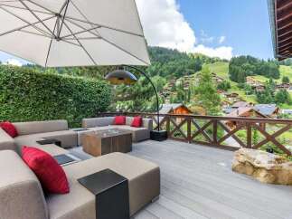 Experience luxury living with this stunning property featuring a spacious outdoor deck and breathtaking mountain views.