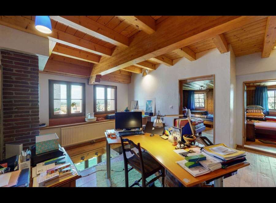 This charming property boasts a unique interior design with exposed wooden beams and a cozy atmosphere.
