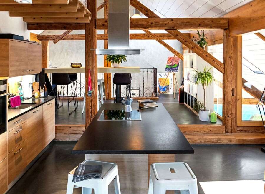 This stunning kitchen boasts a modern design with a touch of rustic charm, perfect for those seeking a unique living space.