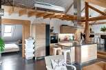 This stunning property boasts a modern kitchen with sleek cabinetry and stainless steel appliances.
