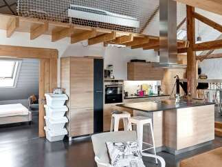 This stunning property boasts a modern kitchen with sleek cabinetry and stainless steel appliances.