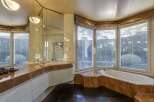 Step into luxury with this stunning bathroom featuring a modern design and high-end finishes.