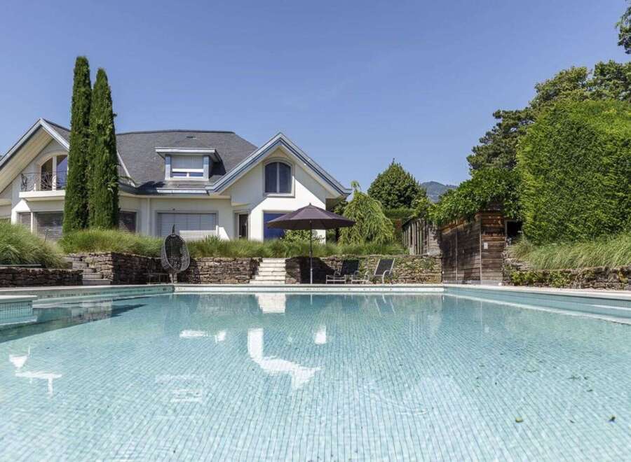 Discover luxury living at its finest with this stunning property featuring a pristine swimming pool and a beautifully designed house.