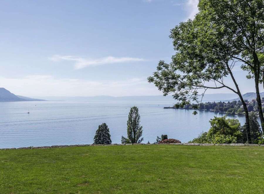 Enjoy breathtaking views of the lake and mountains from this stunning property.