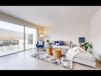 Experience luxury living with this stunning property, featuring a spacious living area with breathtaking mountain views.