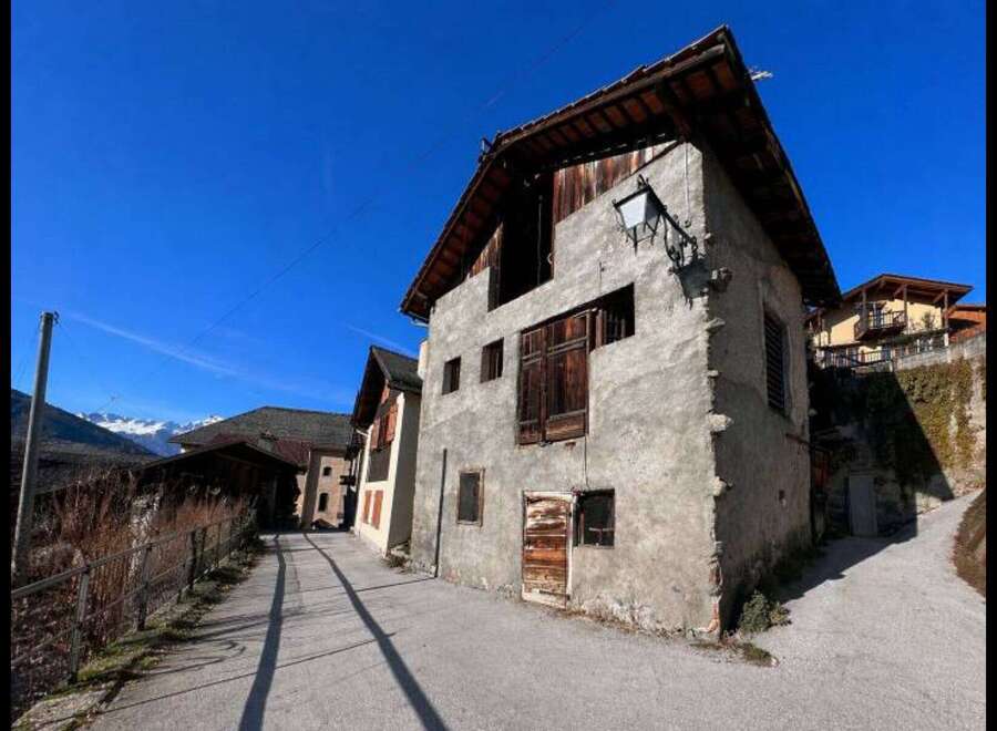 Discover the charm of this unique property, featuring a rustic facade and traditional architecture.