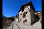 Discover the charm of this unique property, featuring a rustic facade and traditional architecture.