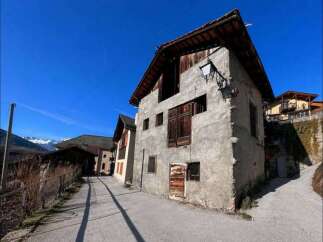 Discover the charm of this unique property, featuring a rustic facade and traditional architecture.