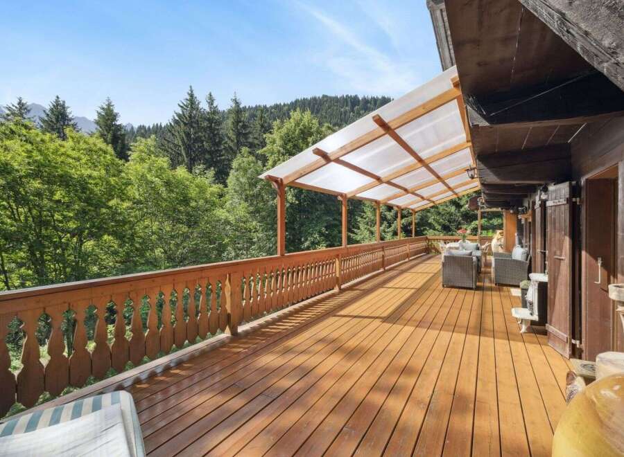 Enjoy breathtaking views from this stunning wooden deck, perfect for relaxation and entertaining.