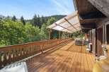 Enjoy breathtaking views from this stunning wooden deck, perfect for relaxation and entertaining.