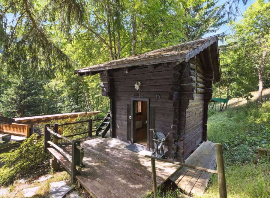 Nestled in a serene forest setting, this charming cabin offers a perfect blend of rustic charm and natural beauty.