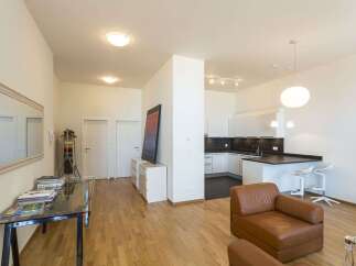 Discover modern living in this stylish apartment! Featuring a sleek kitchen with a breakfast bar, perfect for entertaining.