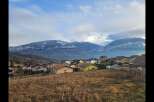 Discover the charm of this picturesque village nestled against a backdrop of majestic, snow-capped mountains.