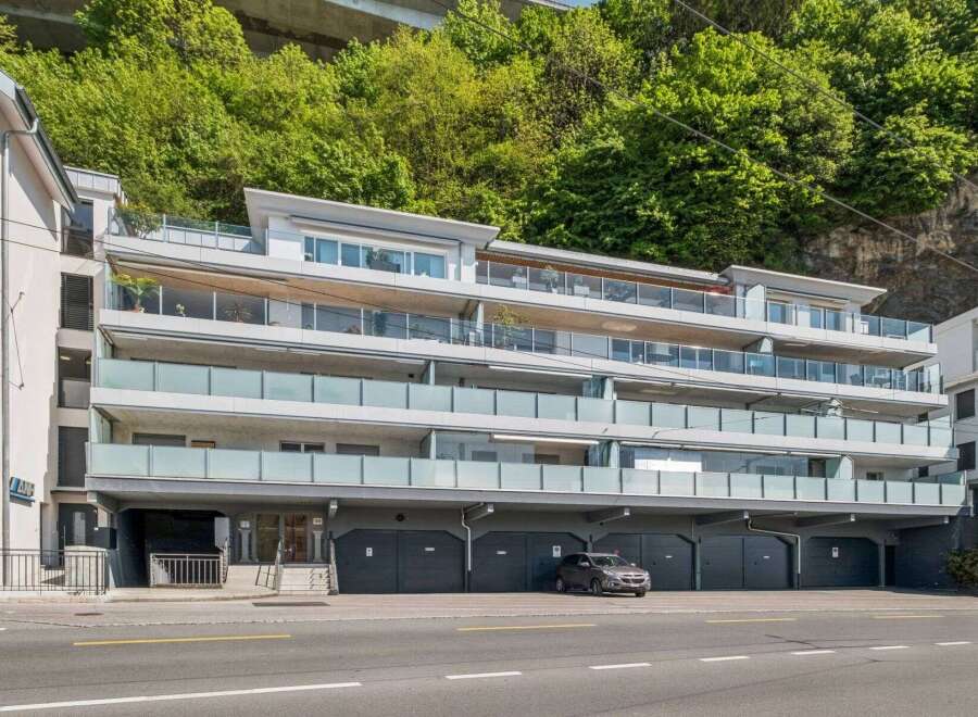 Discover modern living in this stunning apartment building, featuring sleek architecture and spacious balconies.
