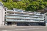 Discover modern living in this stunning apartment building, featuring sleek architecture and spacious balconies.