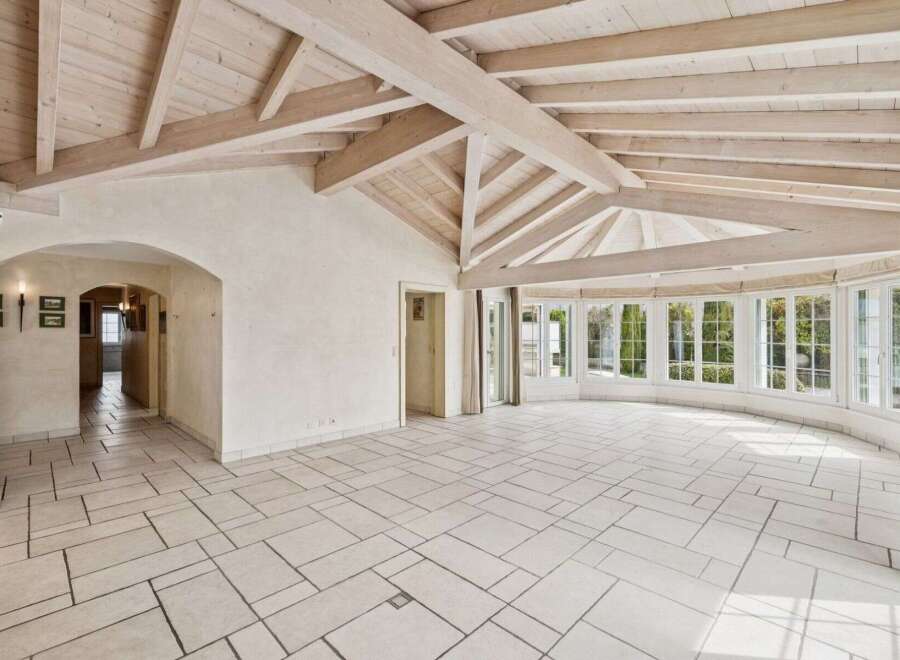 This stunning property boasts a spacious interior with a unique architectural design.