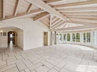 This stunning property boasts a spacious interior with a unique architectural design.