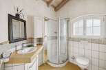This charming bathroom features a bright and airy design, perfect for relaxation.