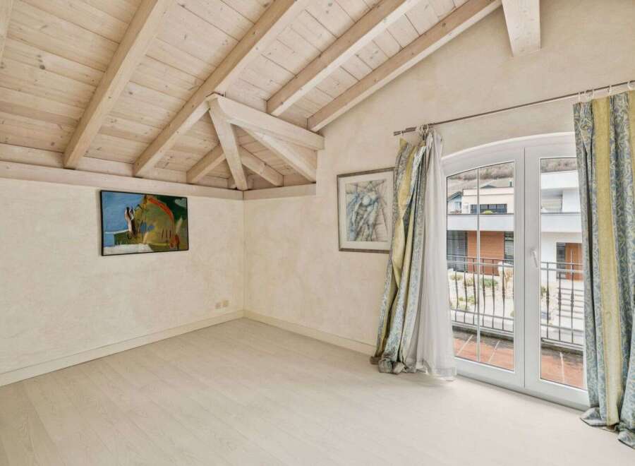 Discover the charm of this inviting property, featuring a bright and airy interior with a unique wooden ceiling design.
