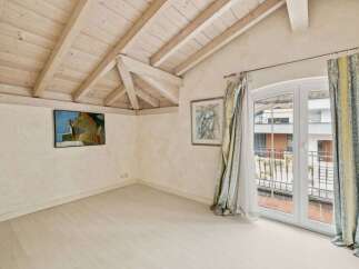 Discover the charm of this inviting property, featuring a bright and airy interior with a unique wooden ceiling design.