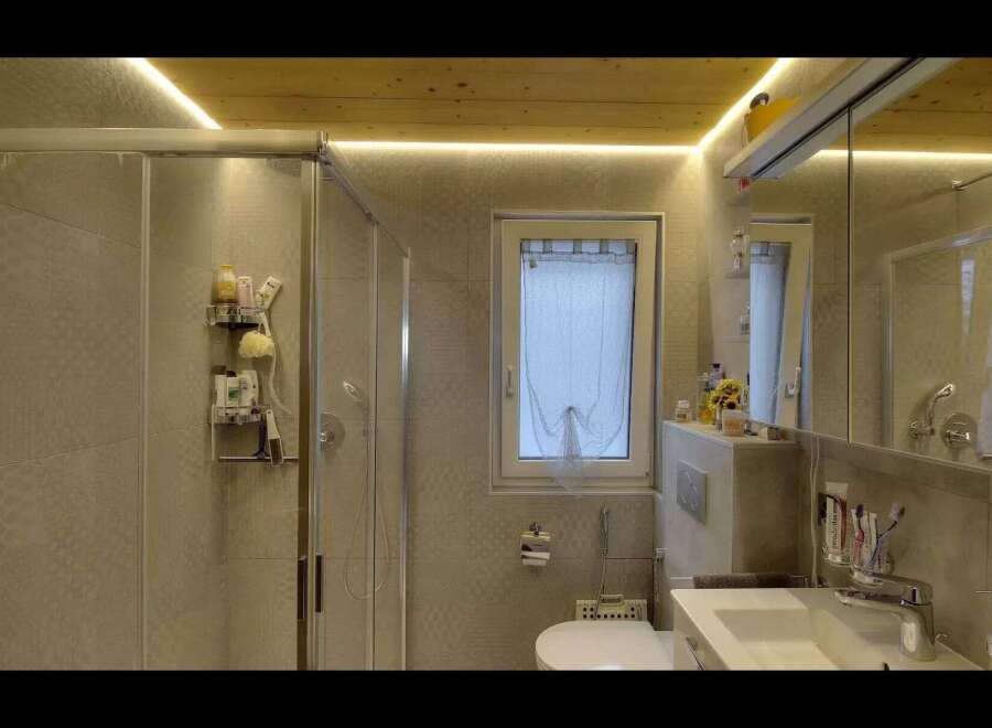Step into a modern bathroom oasis! This beautifully designed space features a sleek glass shower, a stylish vanity, and a convenient toilet.