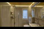 Step into a modern bathroom oasis! This beautifully designed space features a sleek glass shower, a stylish vanity, and a convenient toilet.