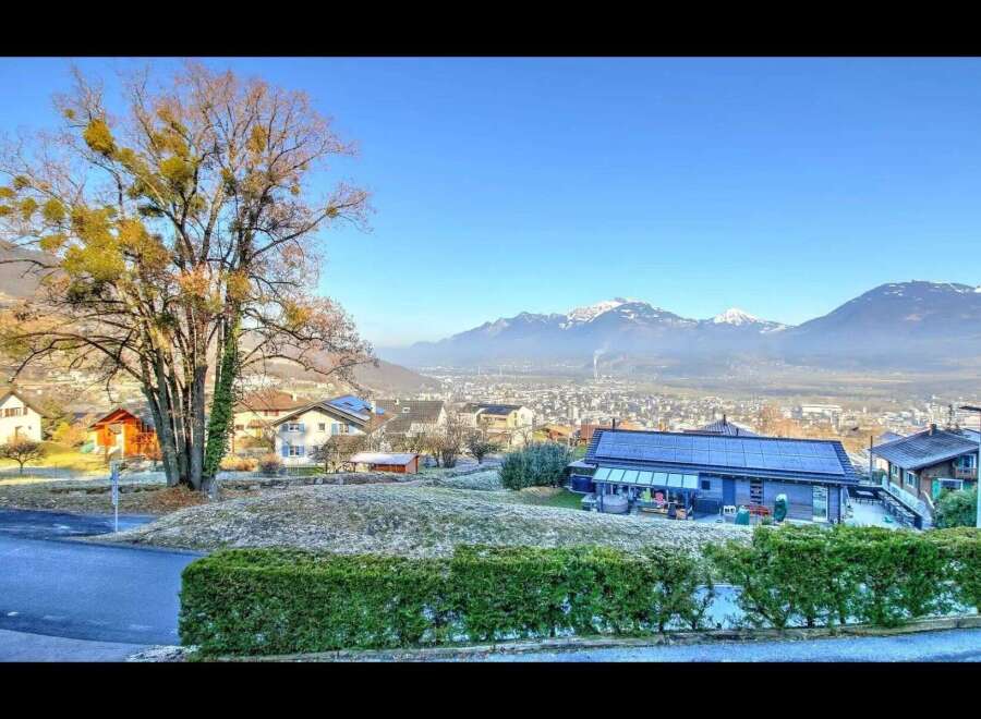Discover your dream home with breathtaking mountain views! This stunning property features a modern design, spacious living areas, and a lush green landscape.