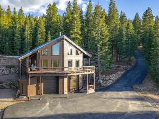 Nestled amidst a lush forest, this stunning property offers a serene retreat.