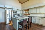 This stunning kitchen boasts a modern design with sleek stainless steel appliances and ample cabinet space.