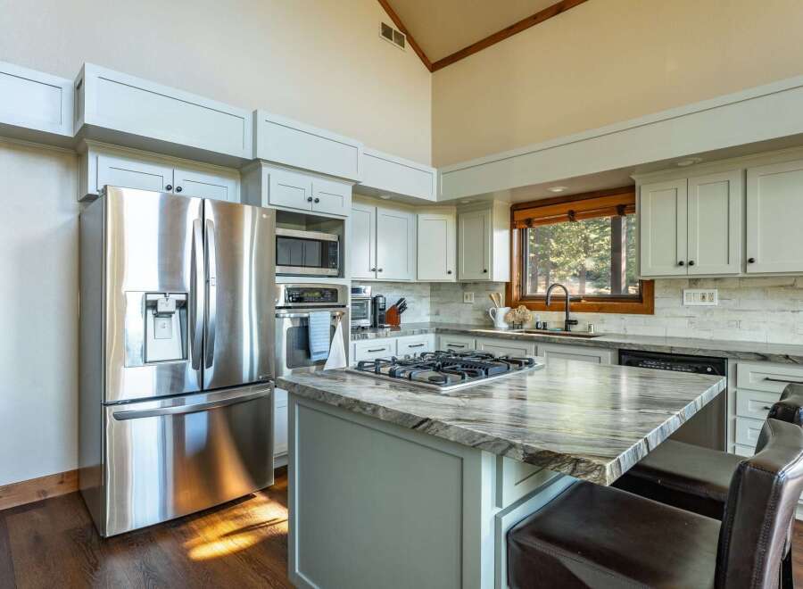 This stunning kitchen boasts modern appliances and elegant design.