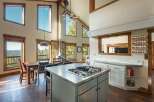 This stunning property boasts a spacious kitchen with a modern gas cooktop and ample counter space, perfect for culinary enthusiasts.
